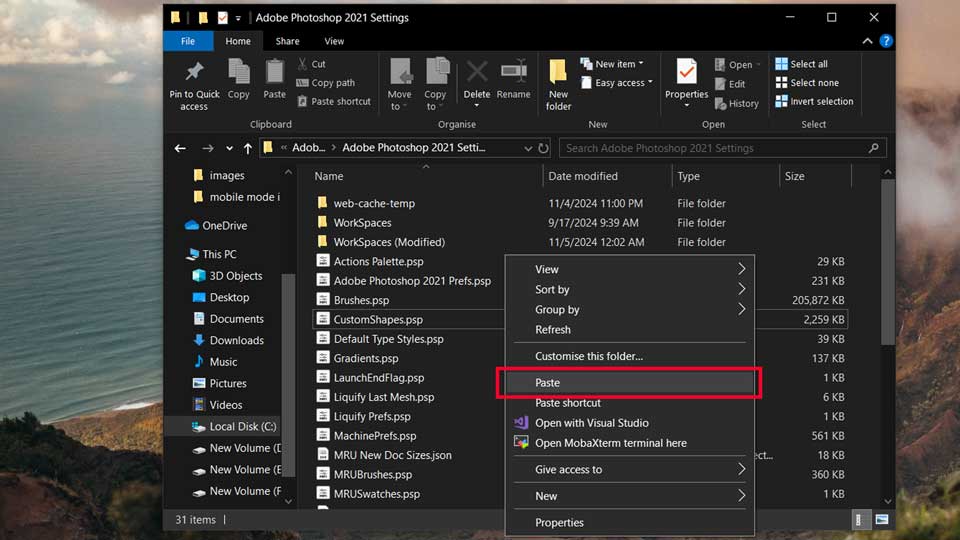 Windows File Explorer showing the Adobe Photoshop 2021 Settings folder with a right-click menu highlighting the 'Paste' option.tutorials